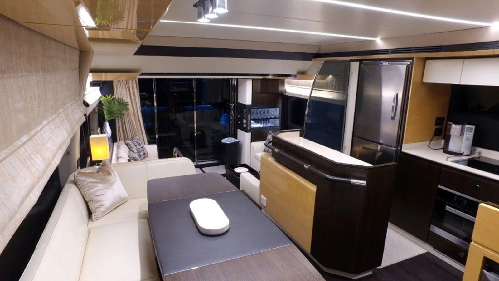 a room with a couch and a table aboard LEVATAR Yacht for Sale