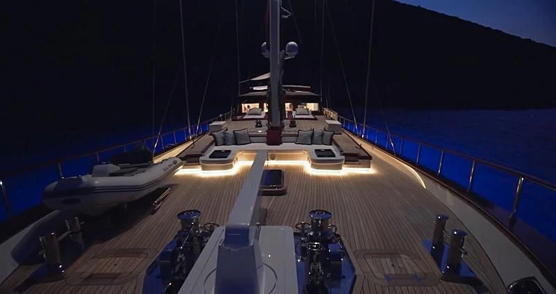 a deck with a boat and a dock with a boat on it aboard THAT'S AMORE Yacht for Sale