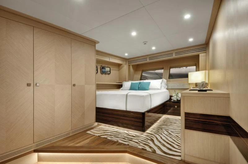 a room with a bed and a couch aboard THAT'S AMORE Yacht for Sale