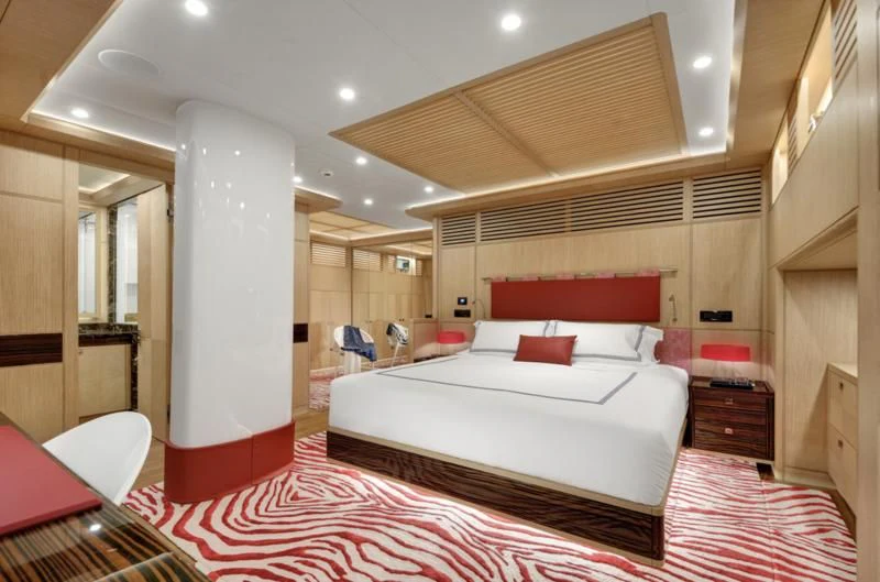 a large bedroom with a large bed aboard THAT'S AMORE Yacht for Sale