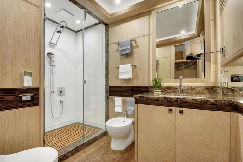 a bathroom with a glass shower aboard THAT'S AMORE Yacht for Sale