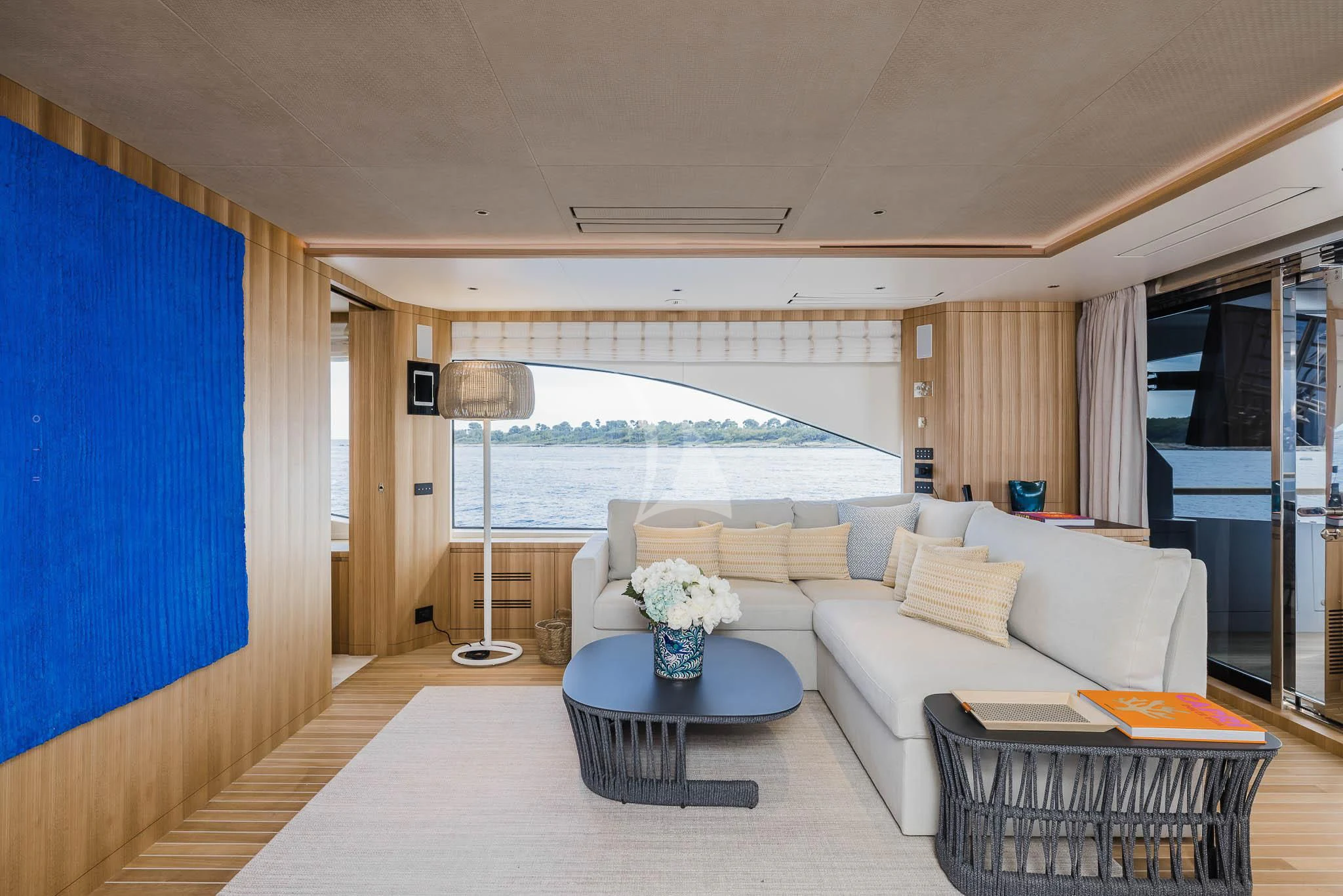 a living room with a large window aboard ADVA Yacht for Sale
