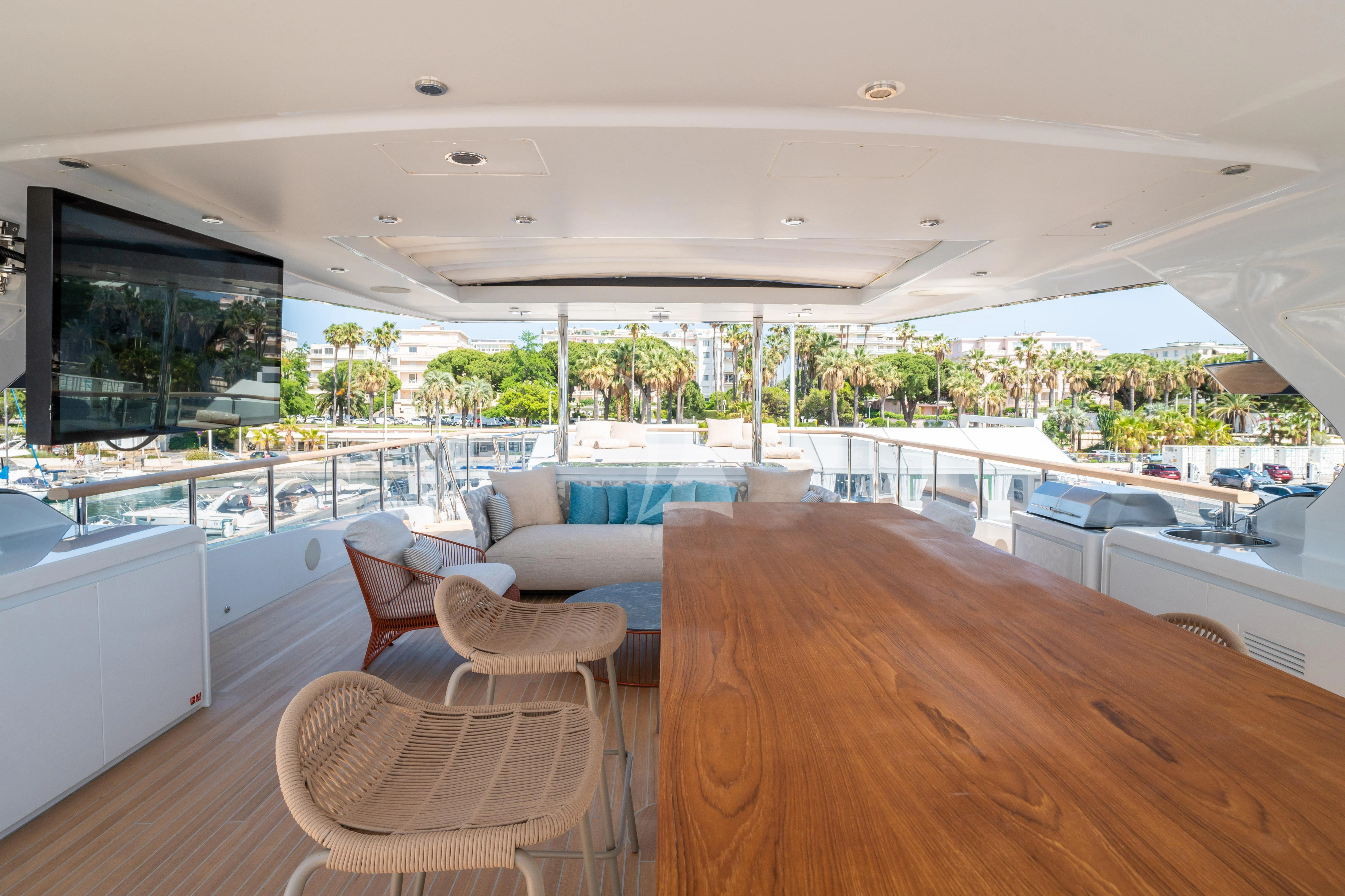 a large living room with a large screen aboard ADVA Yacht for Sale