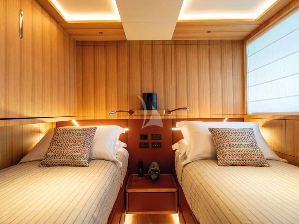 a room with two beds aboard ADVA Yacht for Sale
