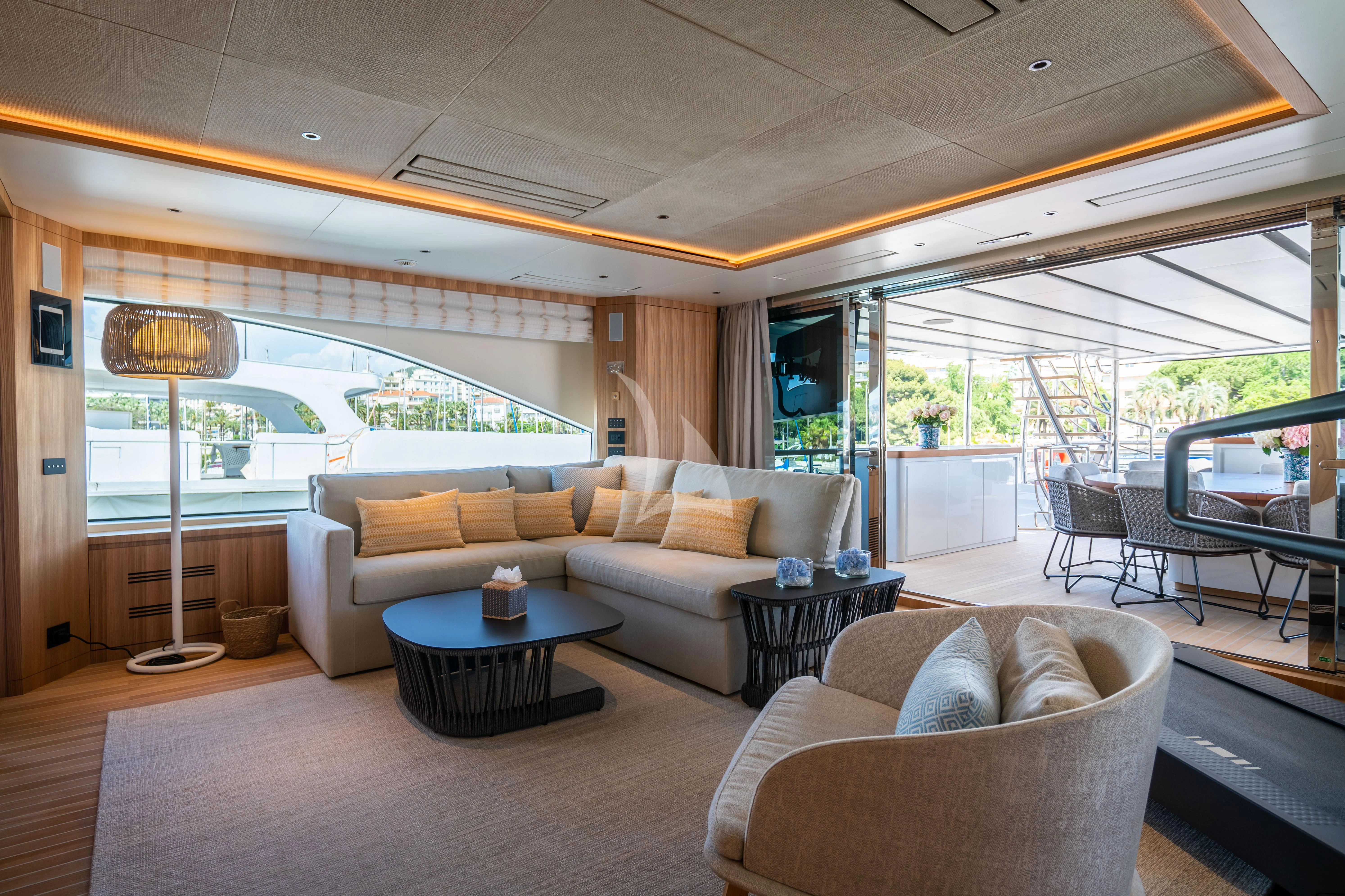 a living room with a large window aboard ADVA Yacht for Sale