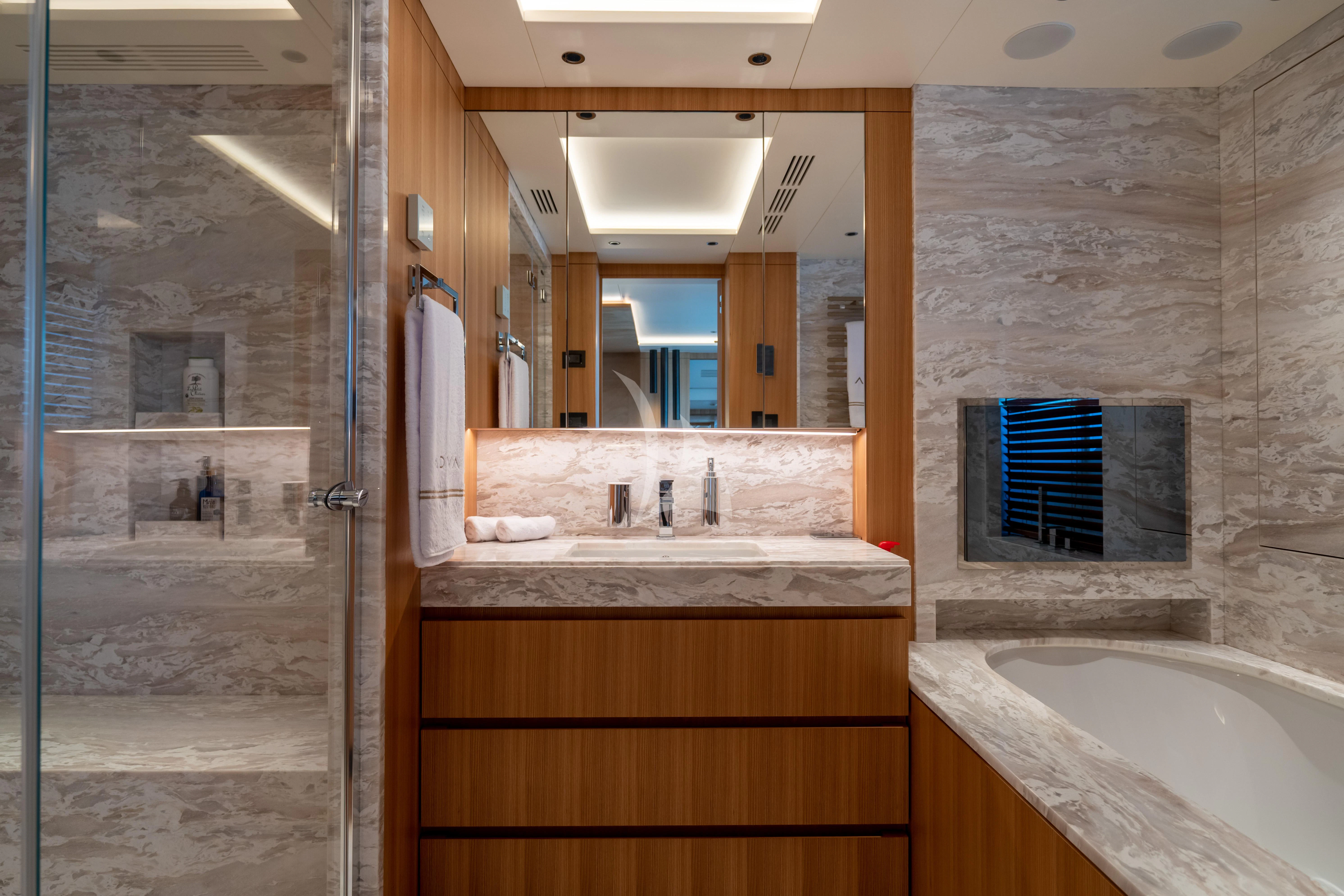 a bathroom with a sink and a shower aboard ADVA Yacht for Sale