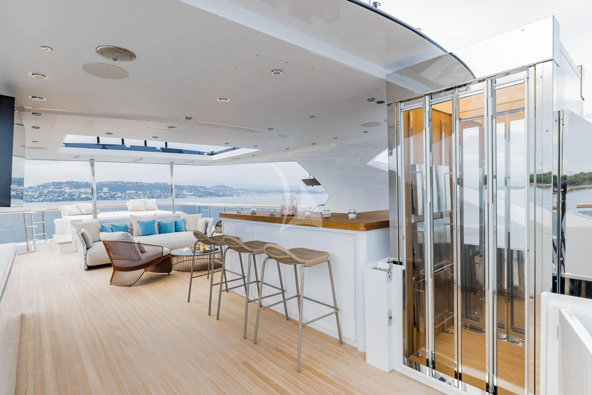 a room with a glass wall and a pool aboard ADVA Yacht for Sale