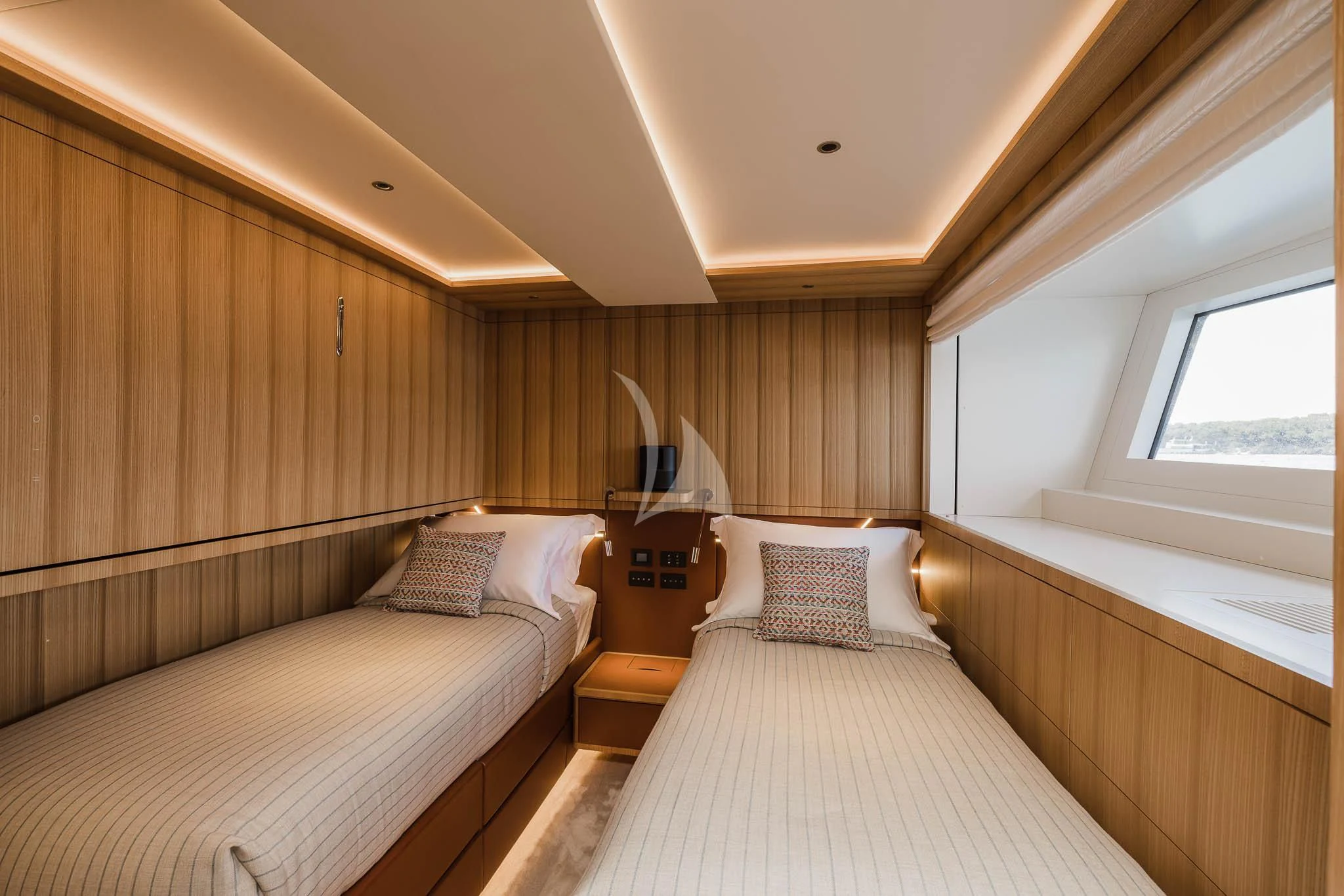 a room with two beds aboard ADVA Yacht for Sale