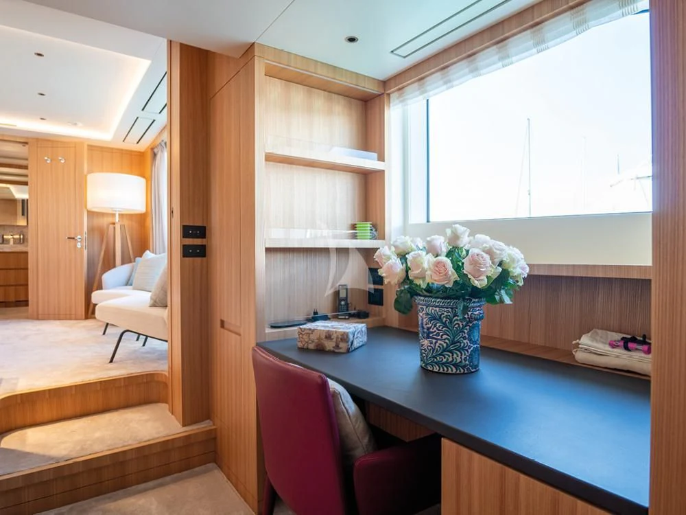 a room with a table and chairs aboard ADVA Yacht for Sale