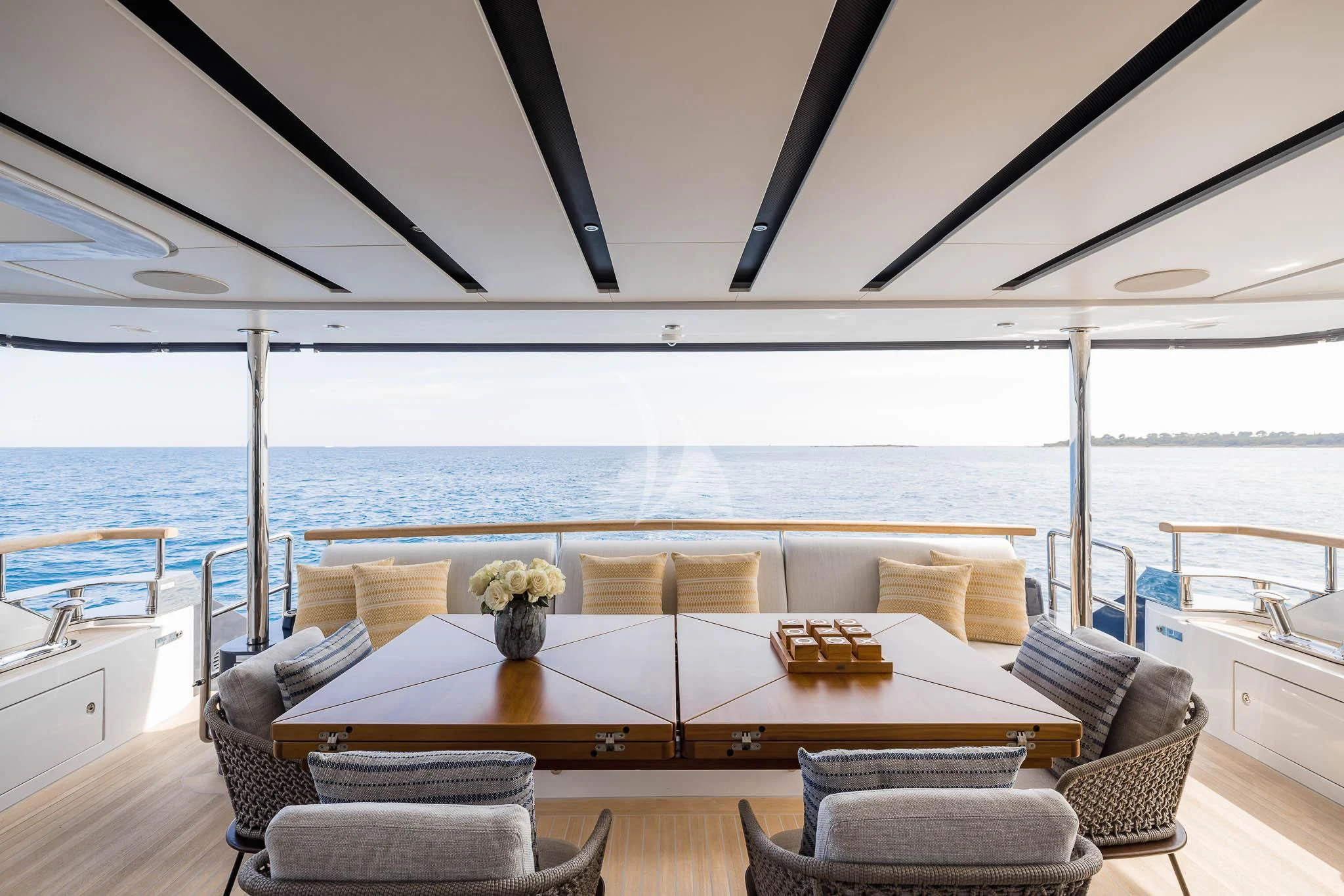 a room with a table and chairs aboard ADVA Yacht for Sale