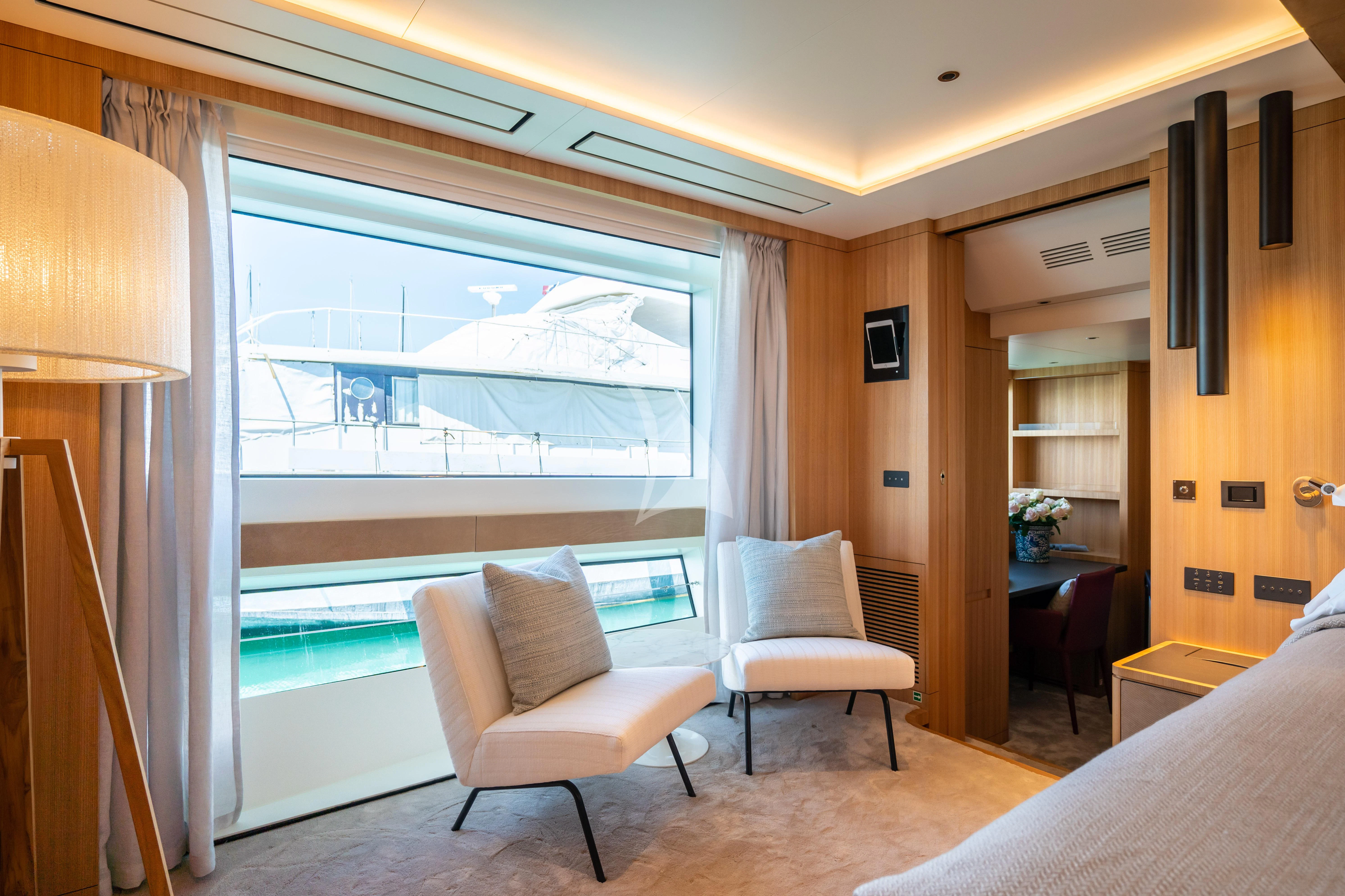 a room with a view of the ocean and a bed aboard ADVA Yacht for Sale