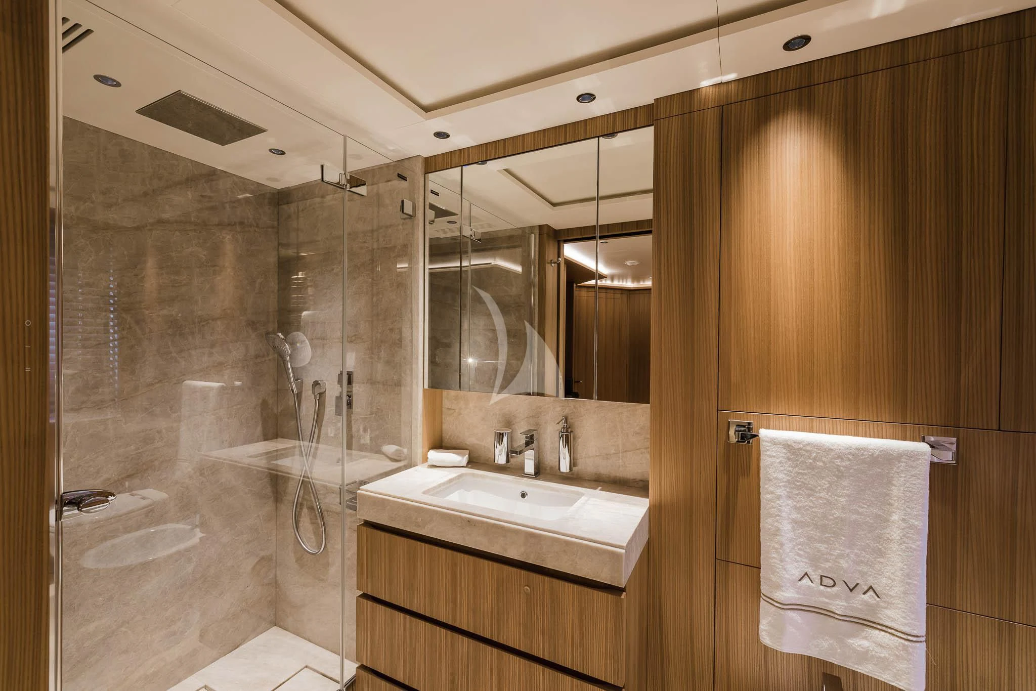a bathroom with a glass shower aboard ADVA Yacht for Sale