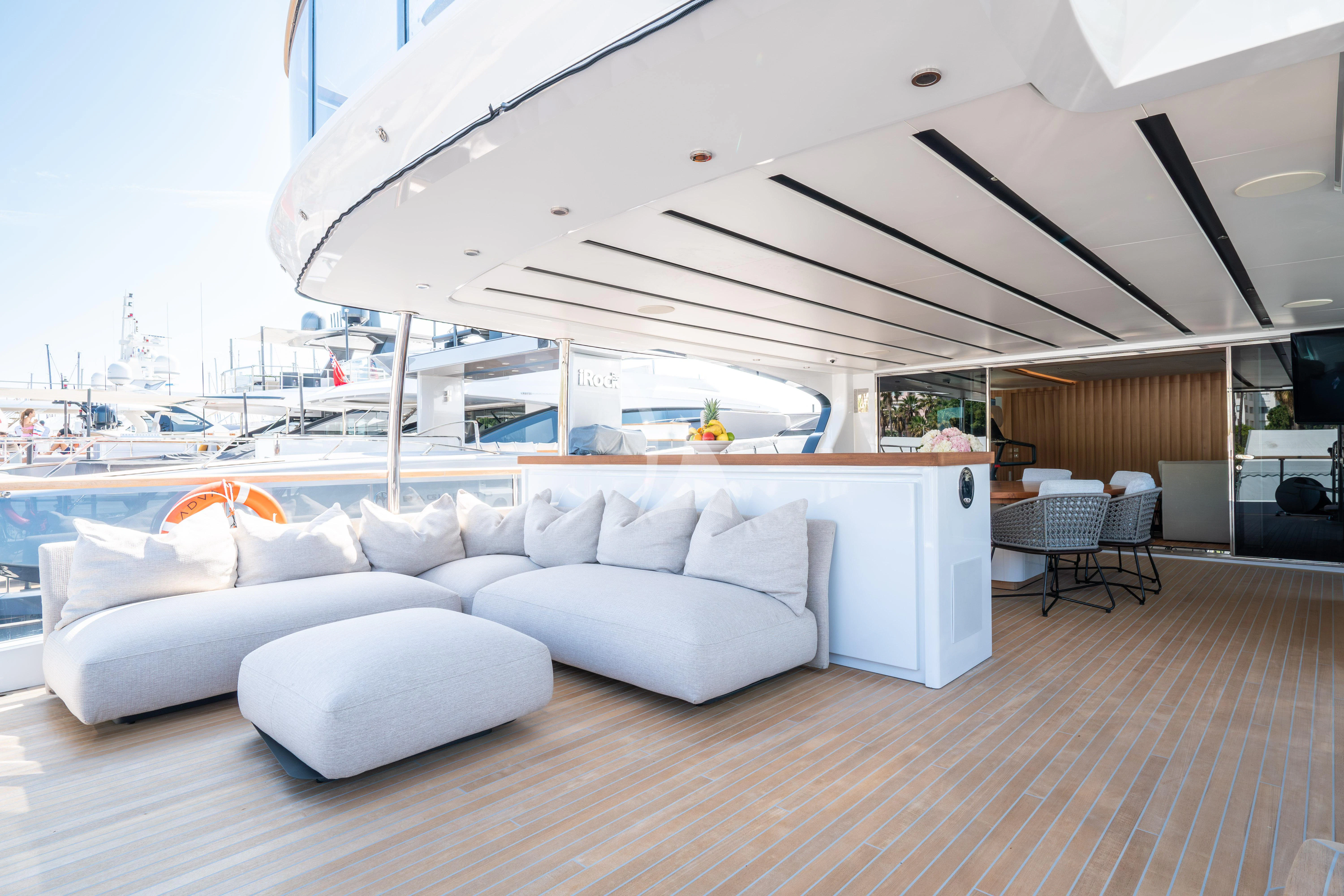 a living room with a large white sofa and a large white sofa aboard ADVA Yacht for Sale