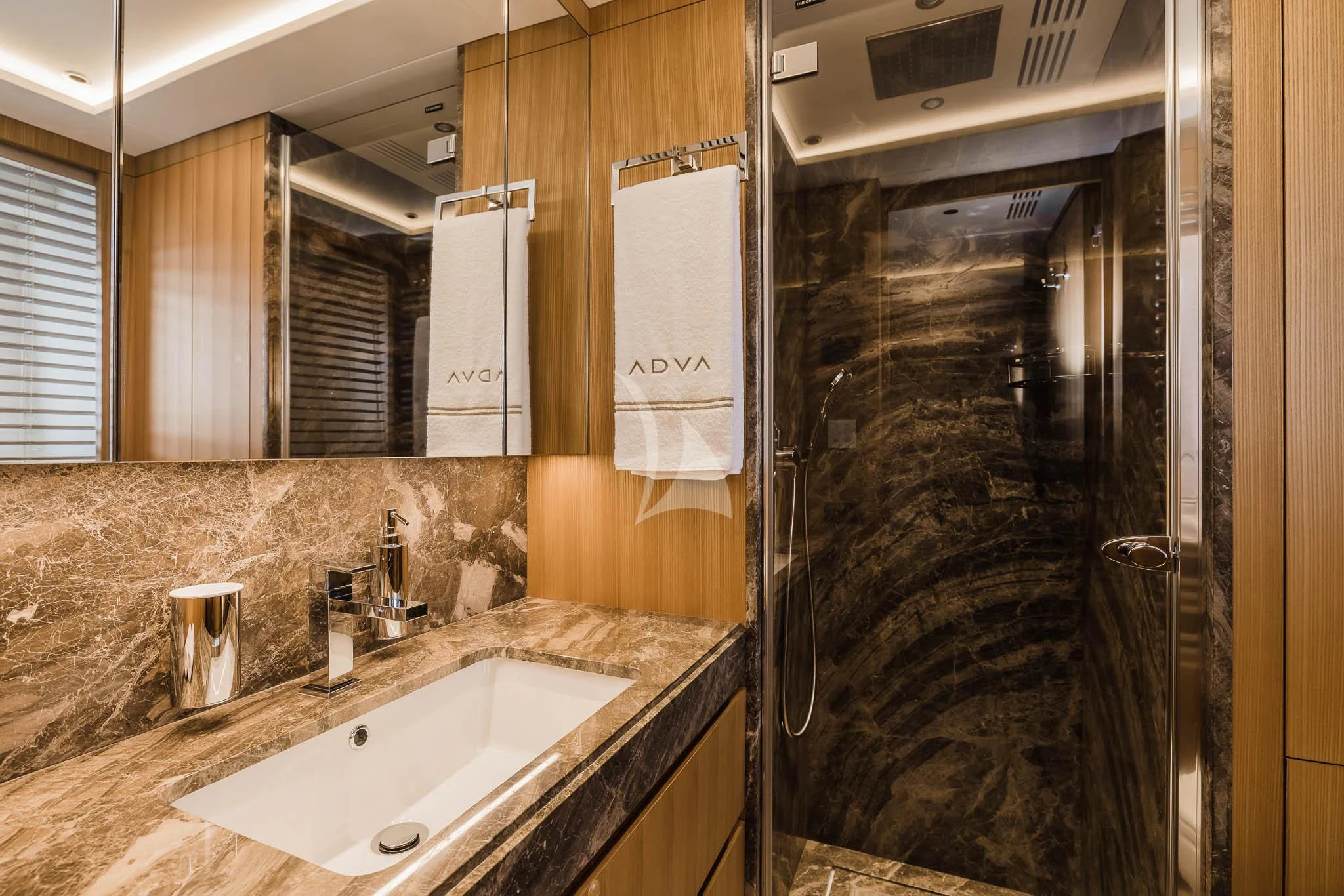 a bathroom with a sink and a shower aboard ADVA Yacht for Sale