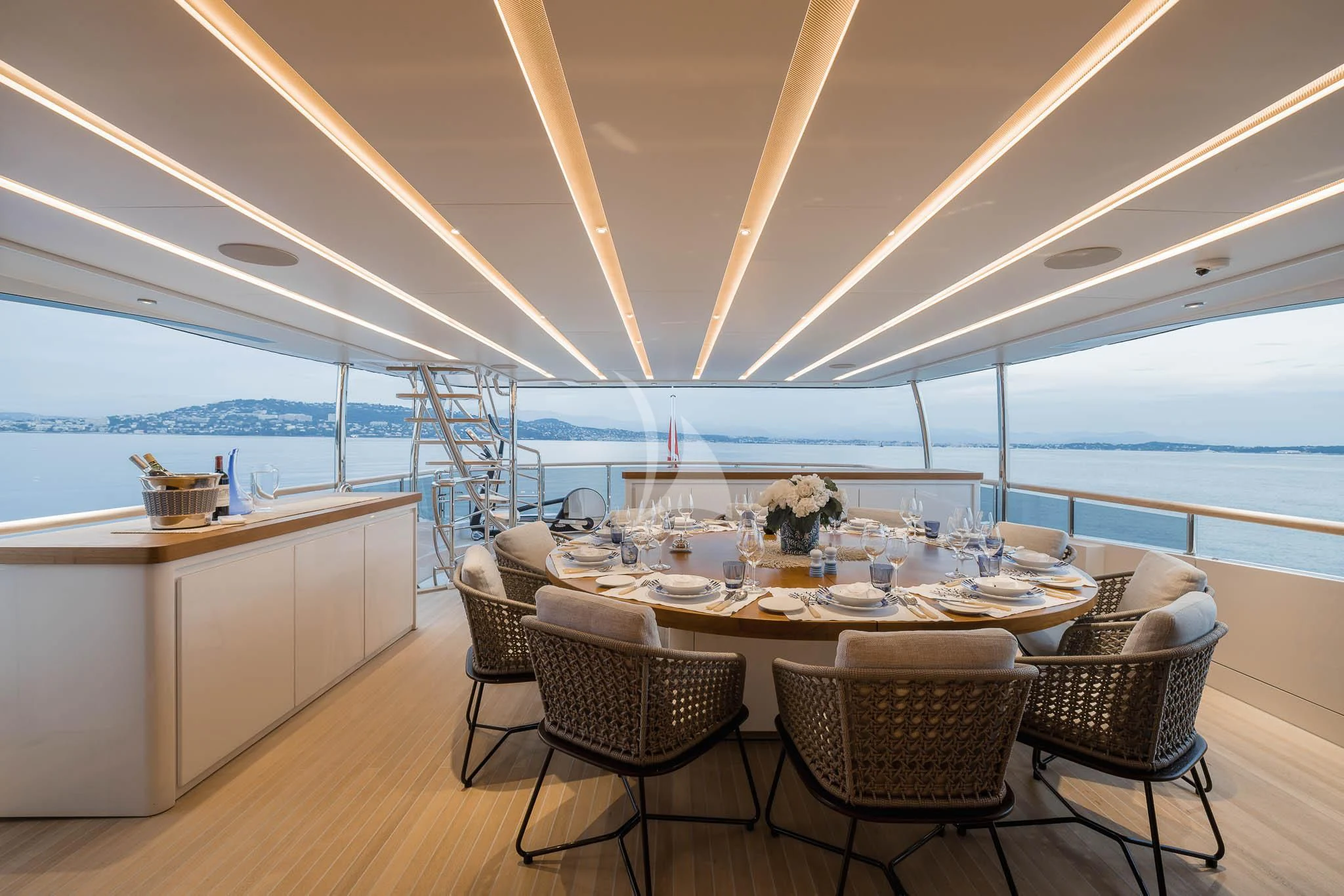 a table with chairs around it aboard ADVA Yacht for Sale