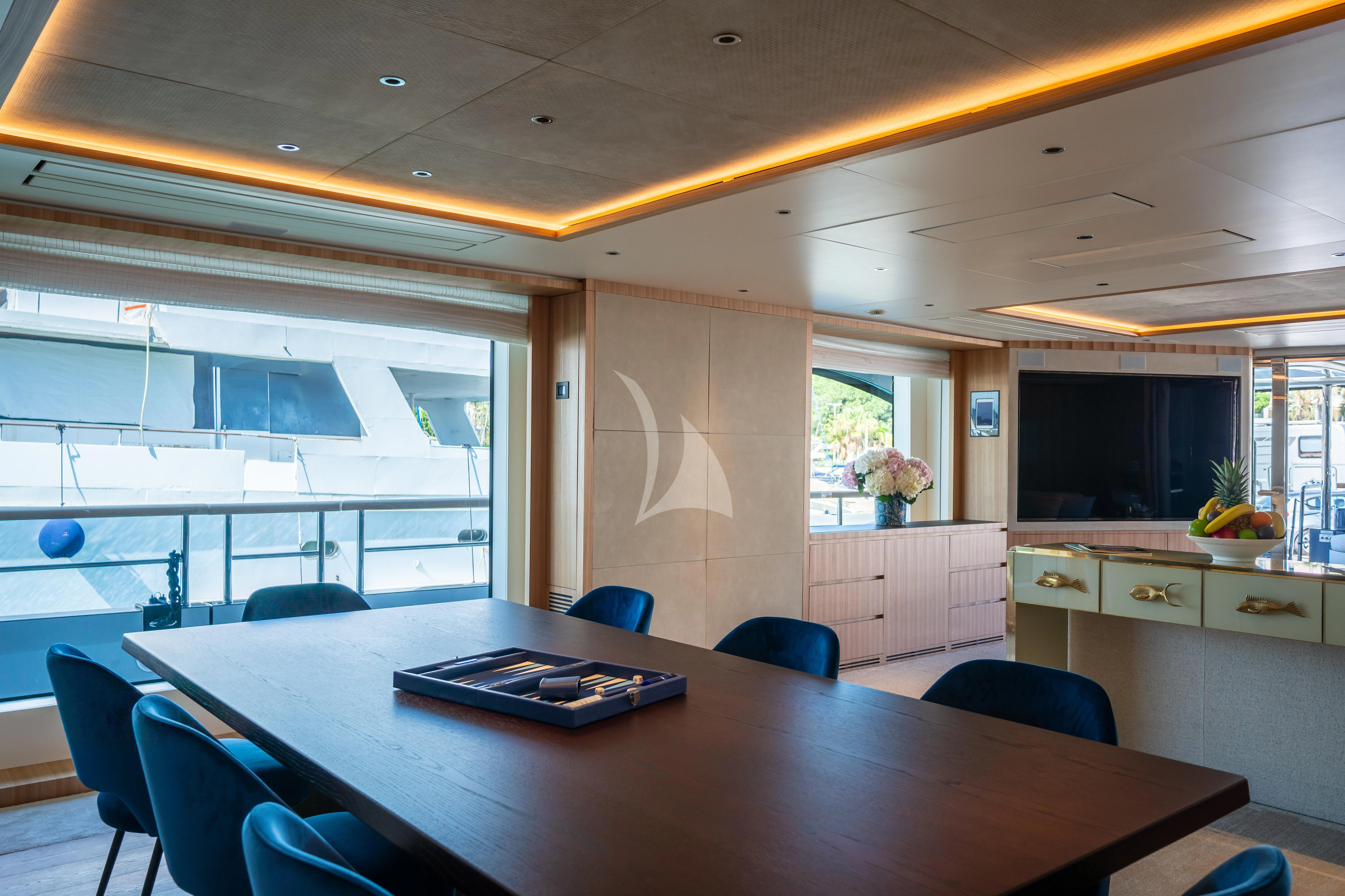 a kitchen with a table and chairs aboard ADVA Yacht for Sale