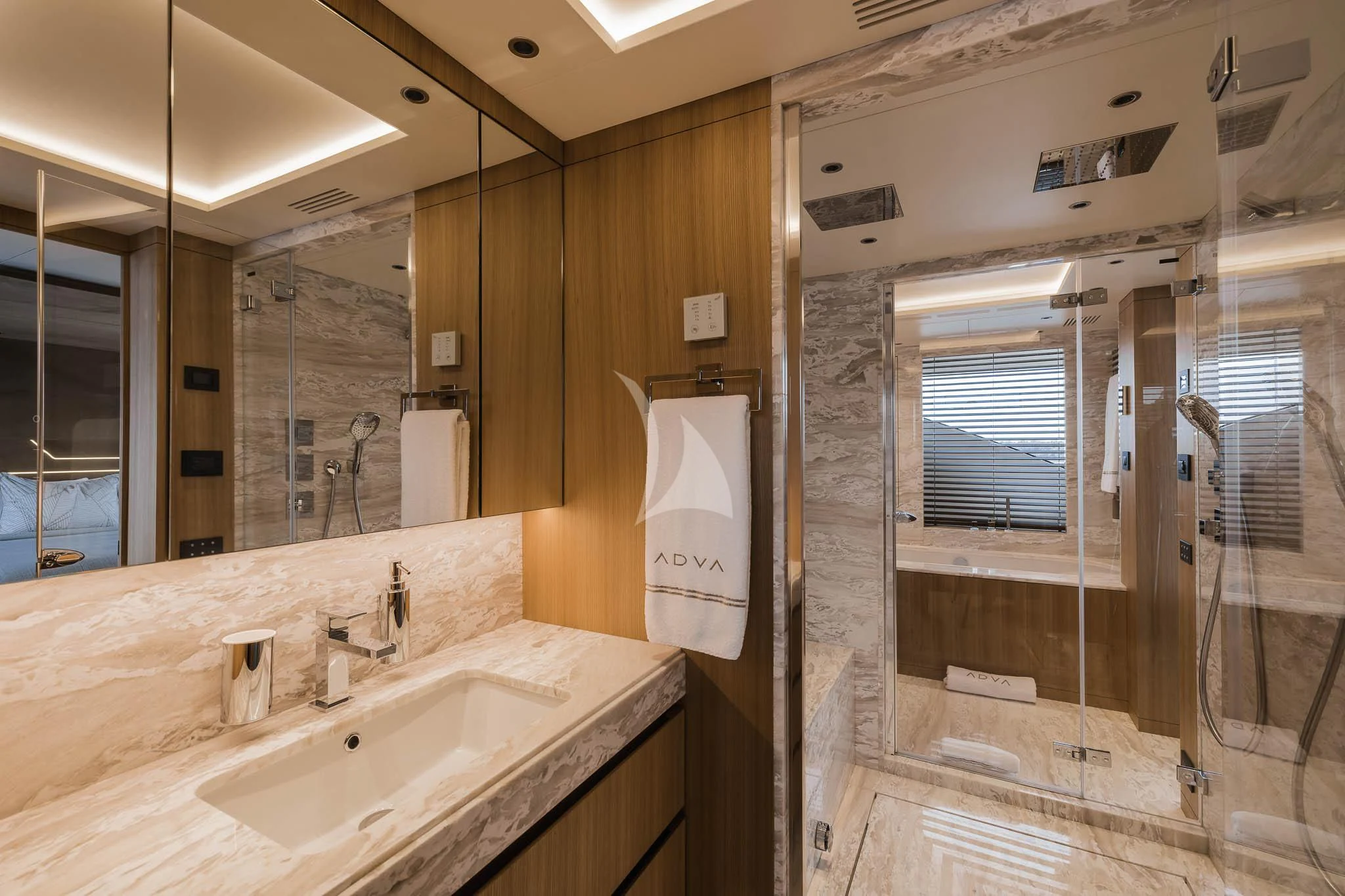 a bathroom with a sink and a mirror aboard ADVA Yacht for Sale