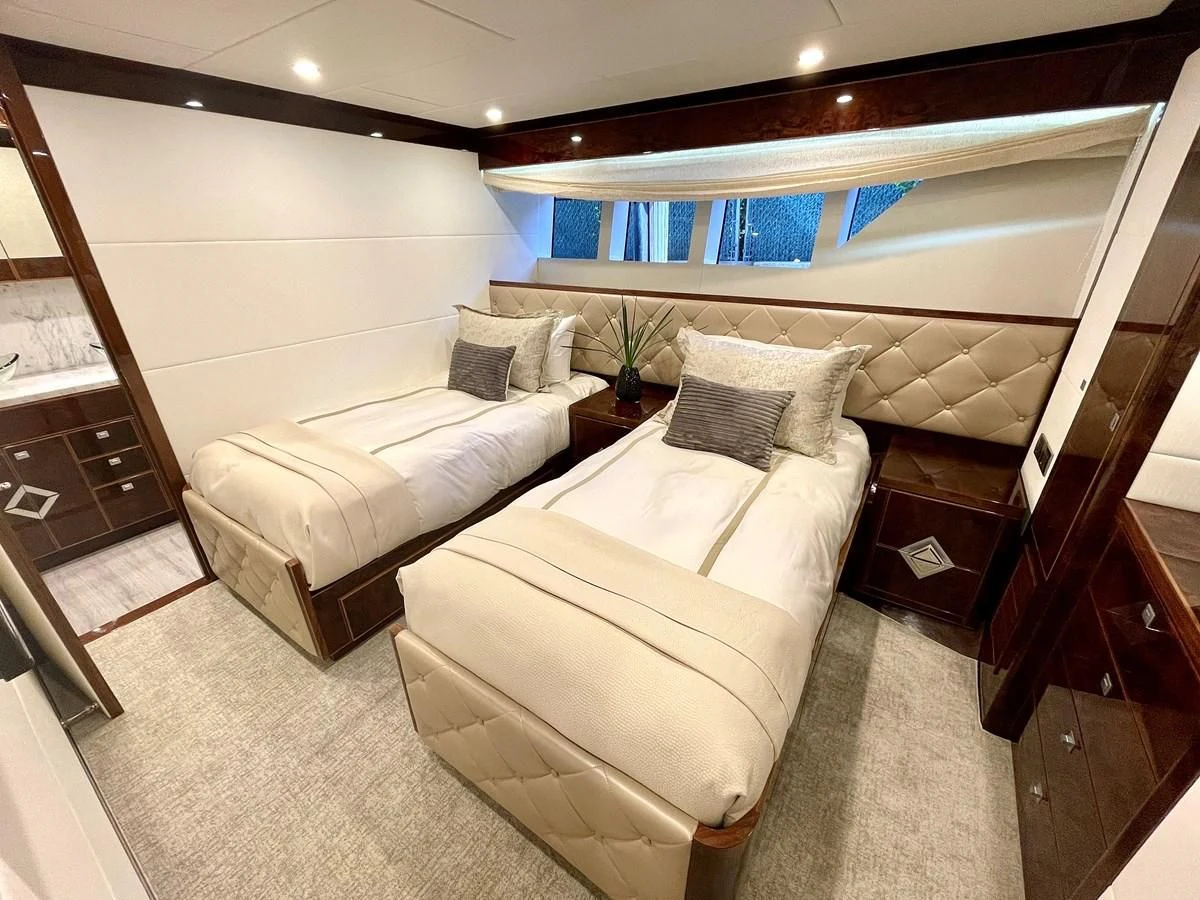 a room with a bed and a wood door aboard NEW BOAT WITH FULL WARRANTIES Yacht for Sale