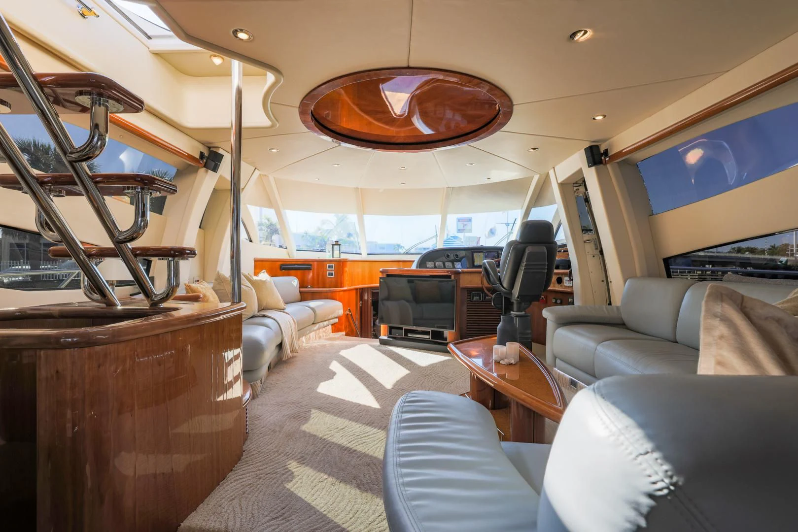 a room with a couch and a television aboard SIROCCO Yacht for Sale