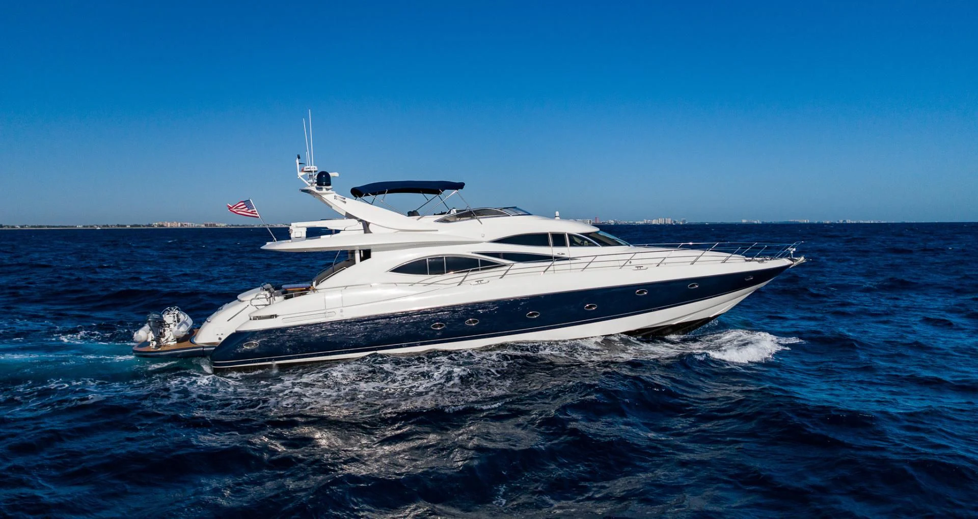 a white yacht in the water aboard SIROCCO Yacht for Sale