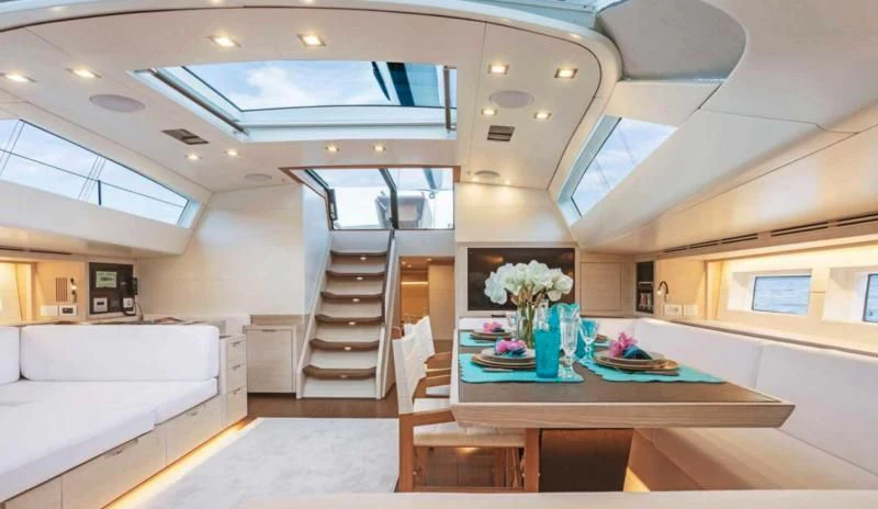 a room with a table and chairs aboard MINDFULNESS Yacht for Charter