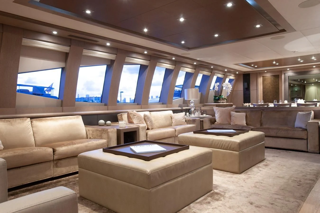 a large living room with a large window aboard DEFIANT Yacht for Sale