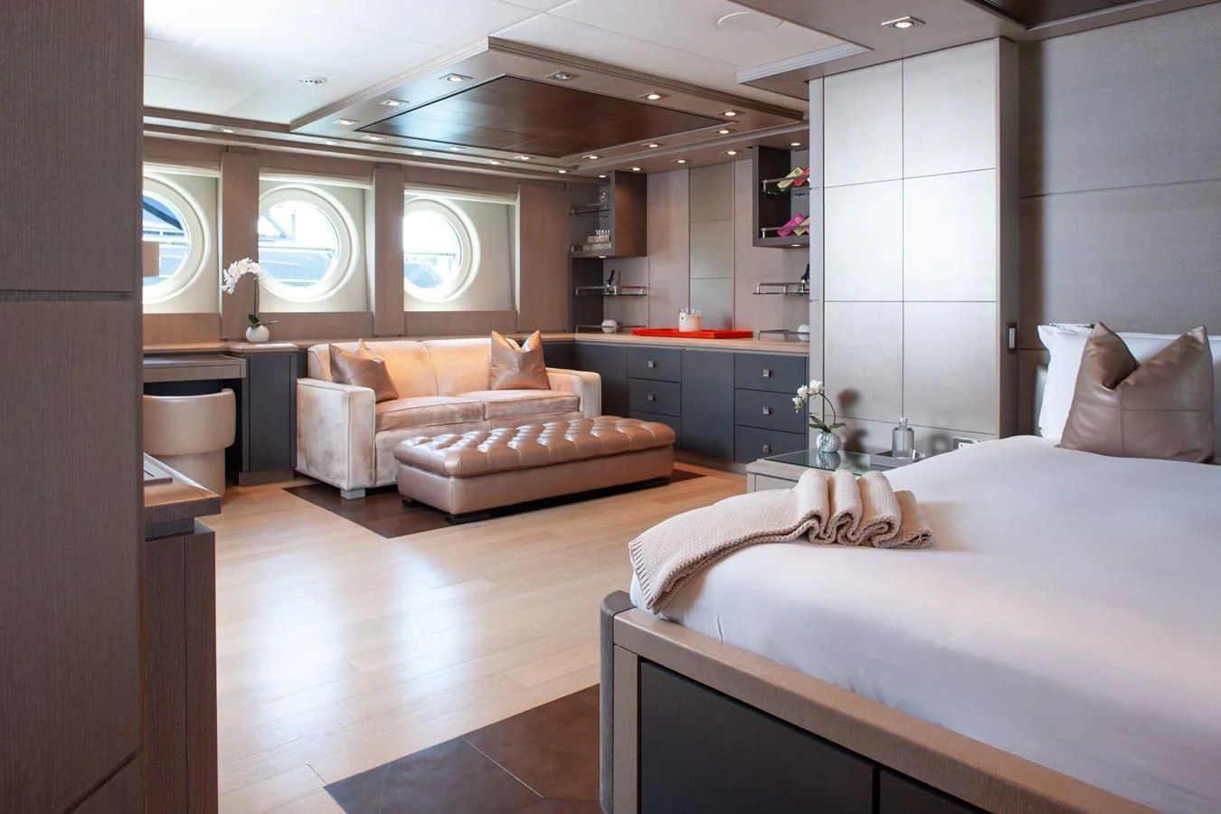 a bedroom with a bed and a couch aboard DEFIANT Yacht for Sale