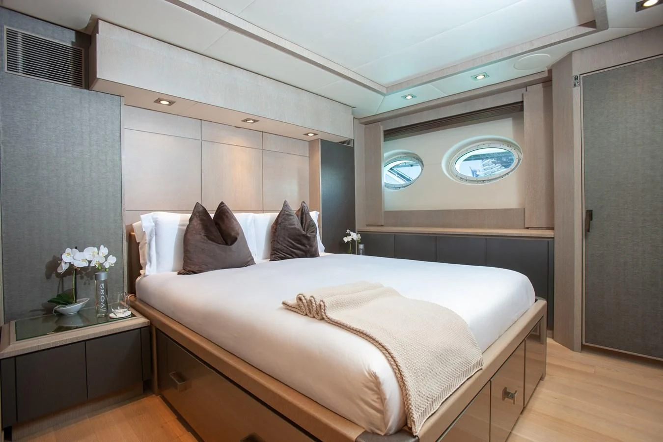 a bed with a white bed aboard DEFIANT Yacht for Sale