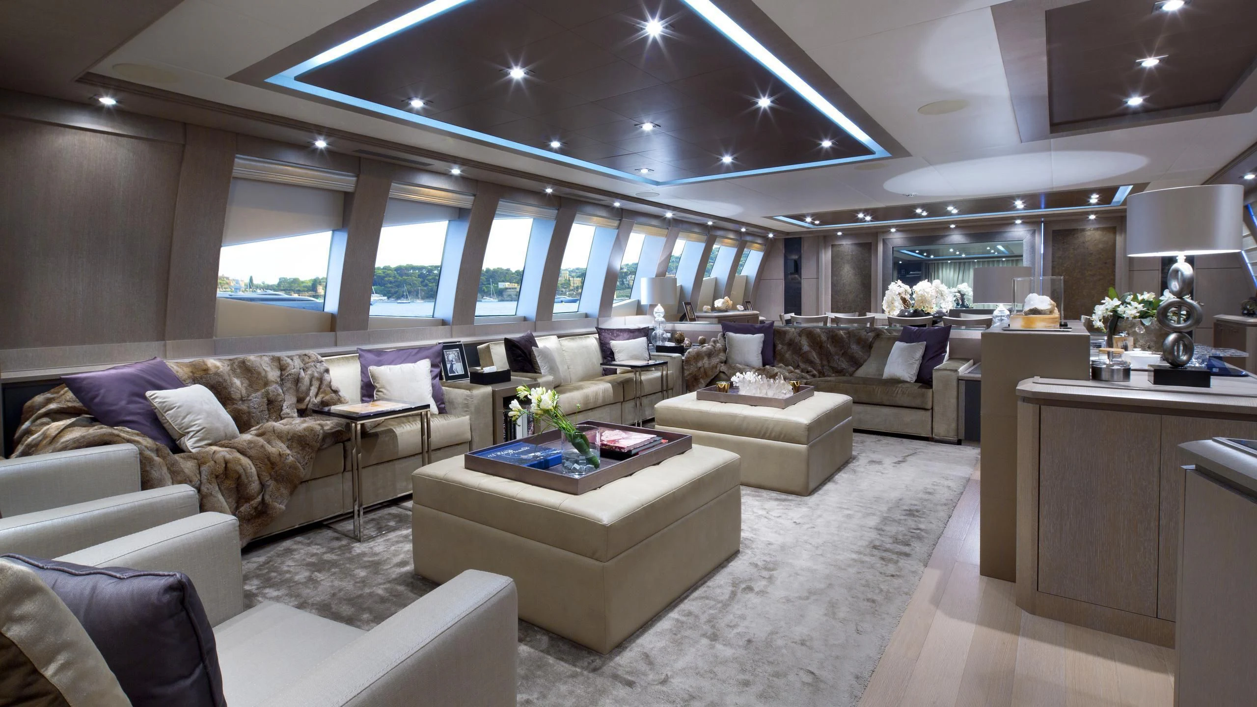 a living room with a couch and a coffee table aboard DEFIANT Yacht for Sale