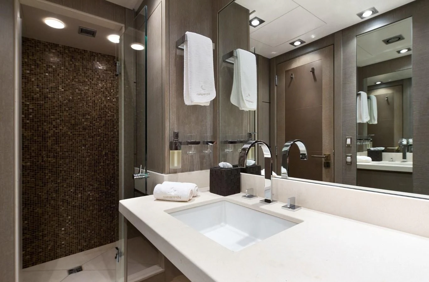 a bathroom with a large mirror aboard DEFIANT Yacht for Sale