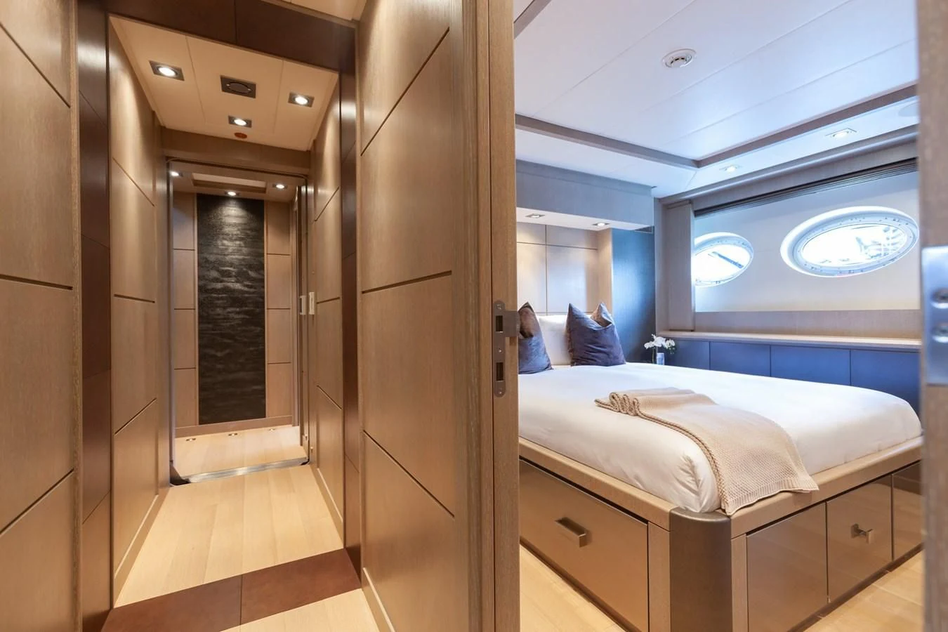 a room with a bed and a window aboard DEFIANT Yacht for Sale