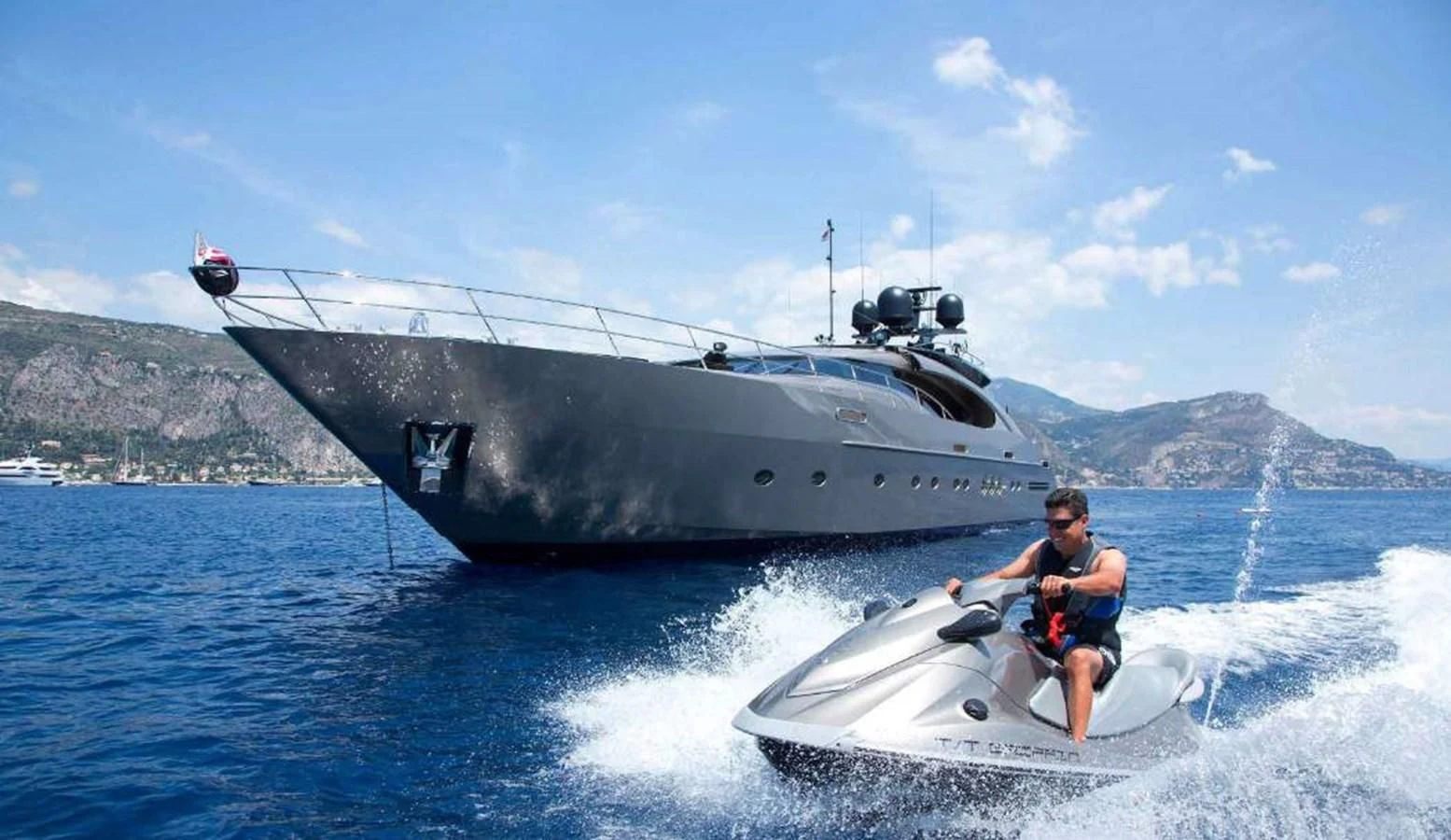 a man on a boat in the water aboard DEFIANT Yacht for Sale