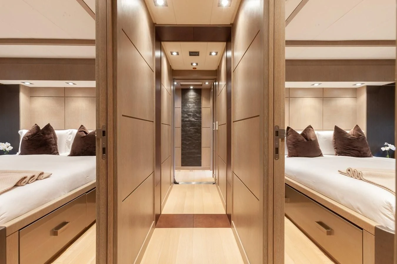 a room with a bed and a mirror aboard DEFIANT Yacht for Sale