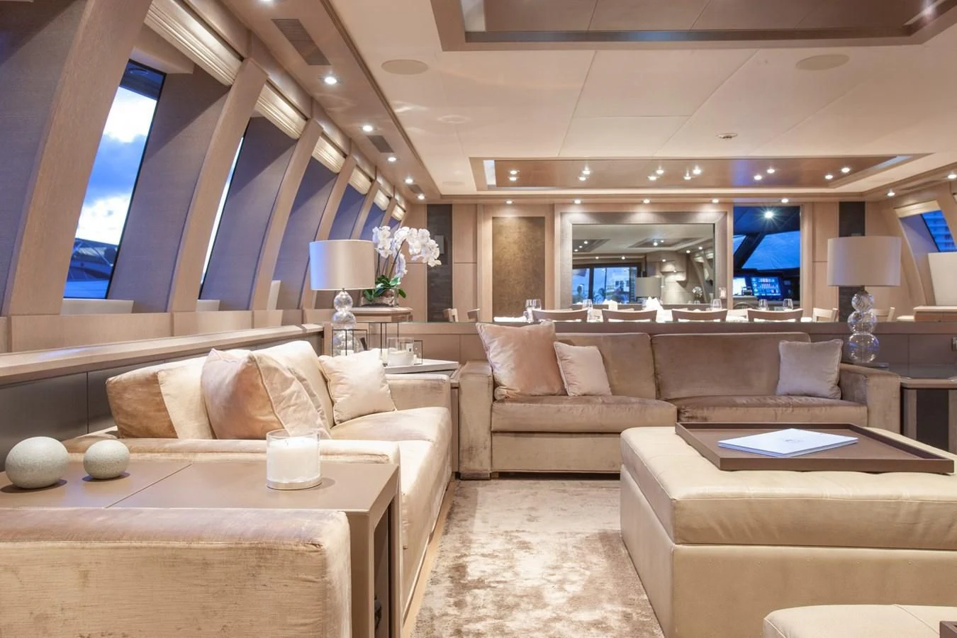 a living room with a large window aboard DEFIANT Yacht for Sale