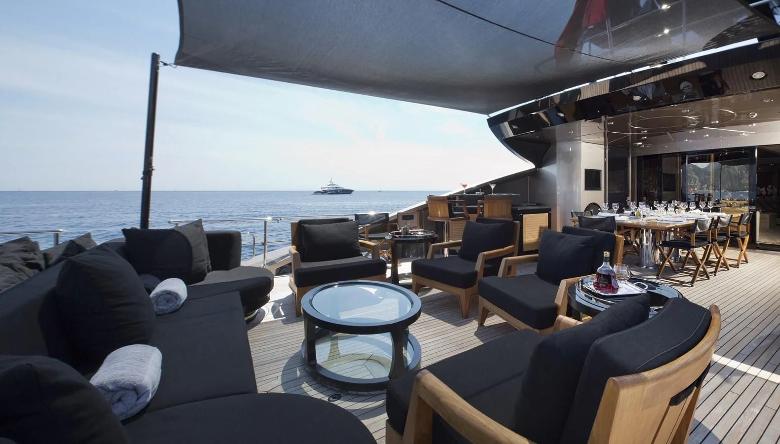 a large living room with a large body of water aboard DEFIANT Yacht for Sale