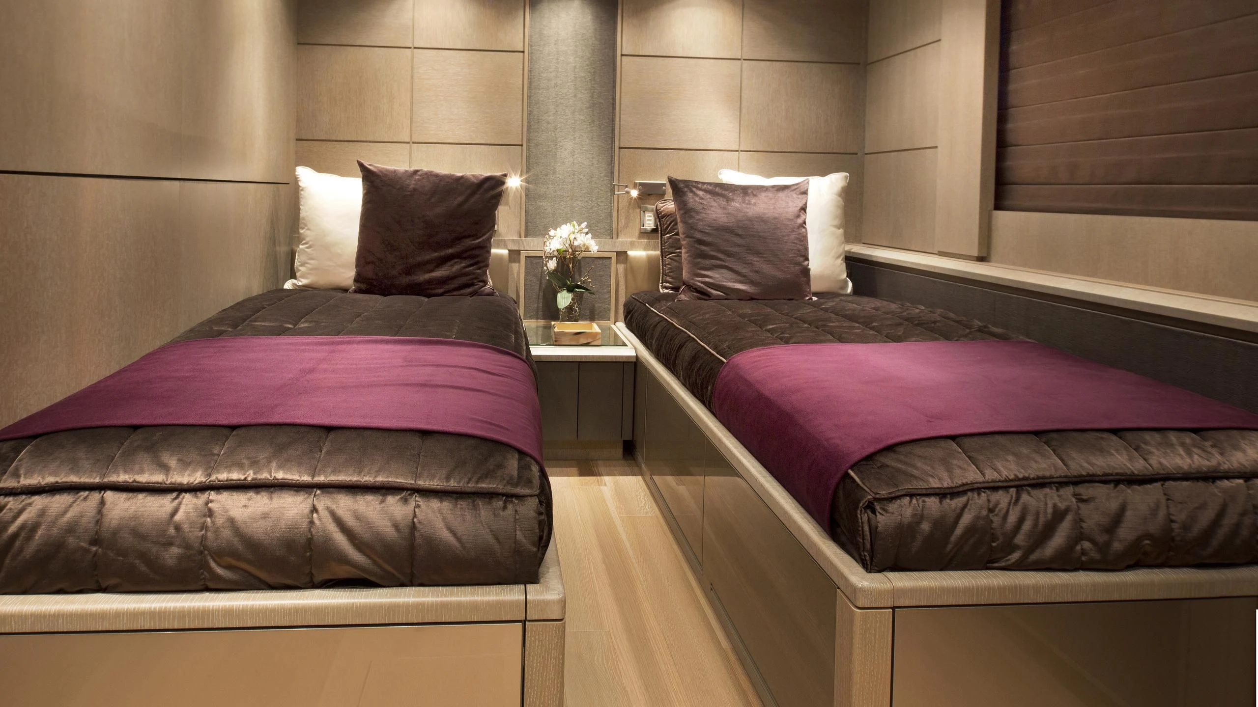 a room with a bed and a couch aboard DEFIANT Yacht for Sale