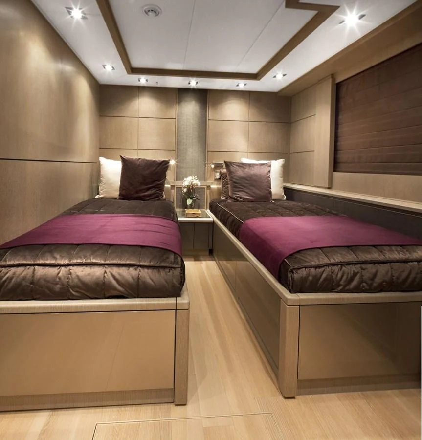 a couple of beds in a hotel room aboard DEFIANT Yacht for Sale
