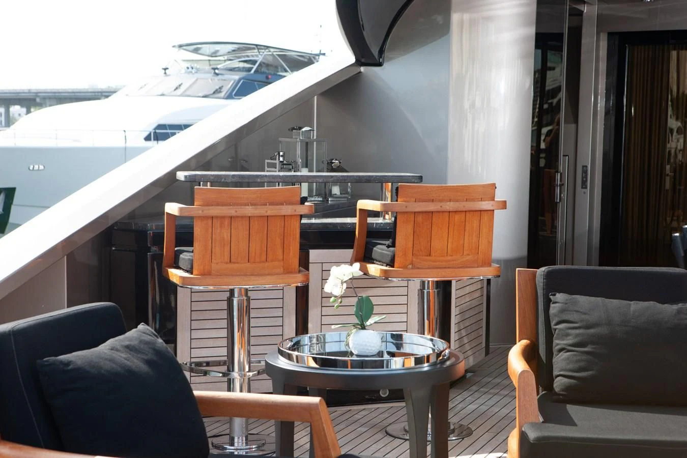a table and chairs on a boat aboard DEFIANT Yacht for Sale