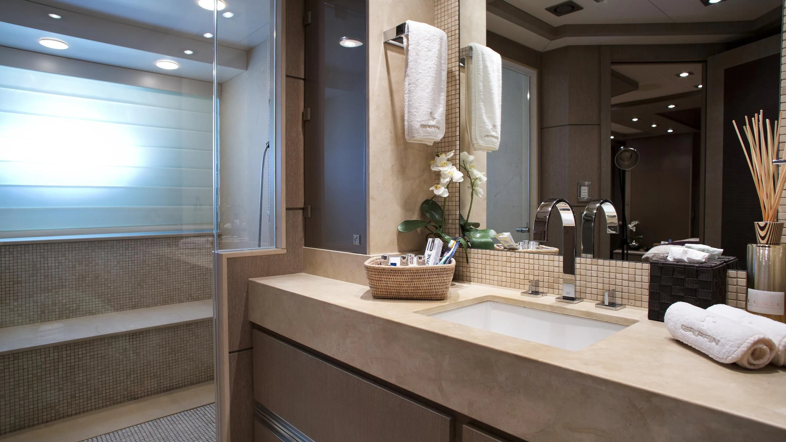 a bathroom with a sink and a mirror aboard DEFIANT Yacht for Sale