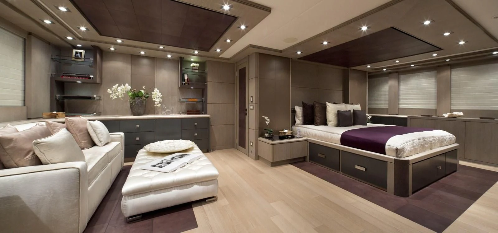 a room with a bed and a couch aboard DEFIANT Yacht for Sale