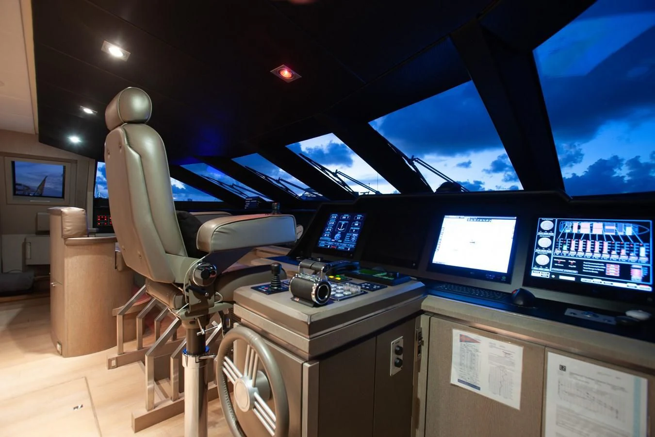 a machine in a room with monitors aboard DEFIANT Yacht for Sale