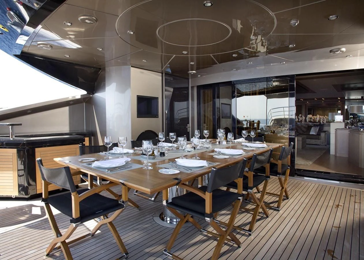 a large dining room with tables and chairs aboard DEFIANT Yacht for Sale
