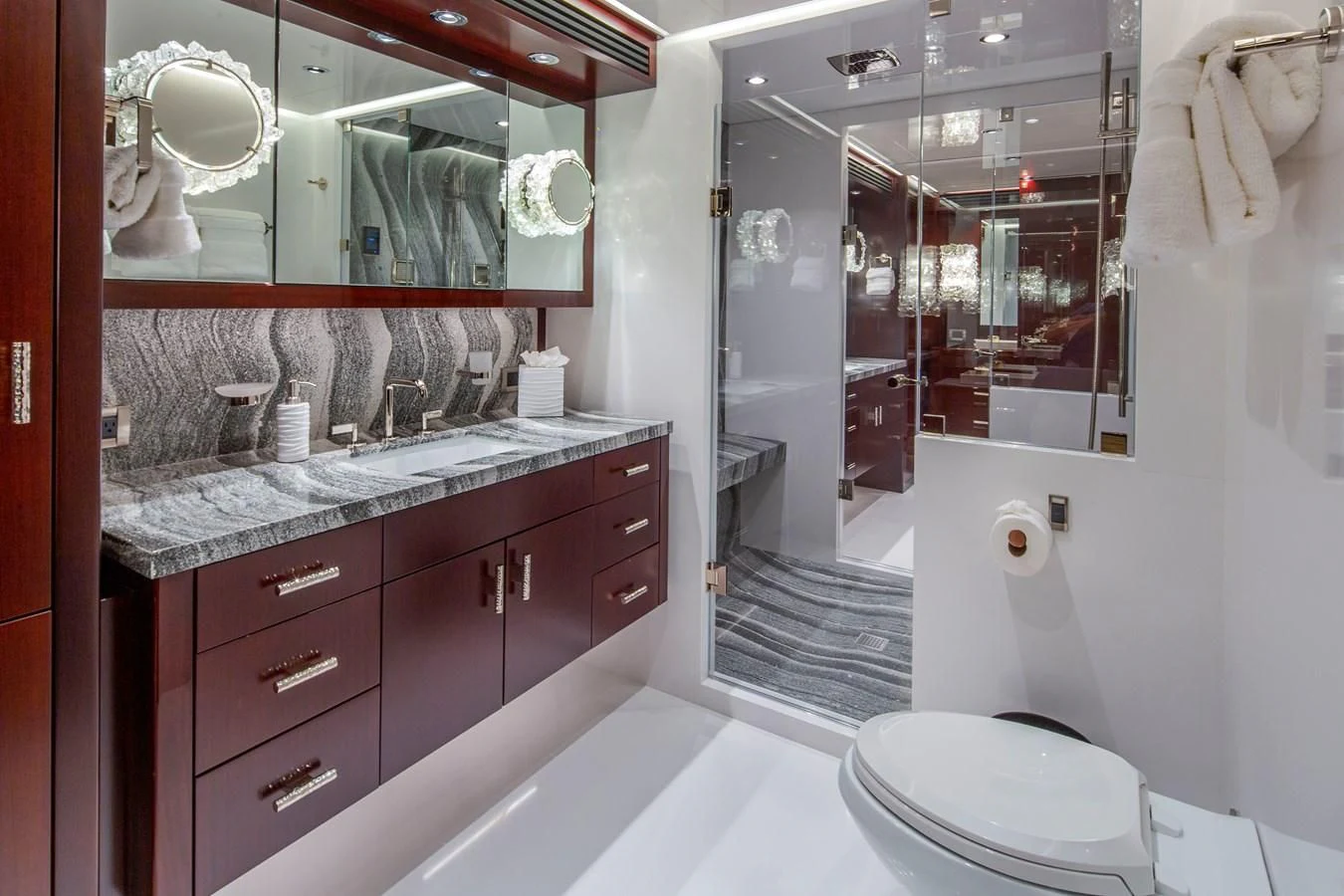 a bathroom with a large mirror aboard LION'S DEN Yacht for Sale