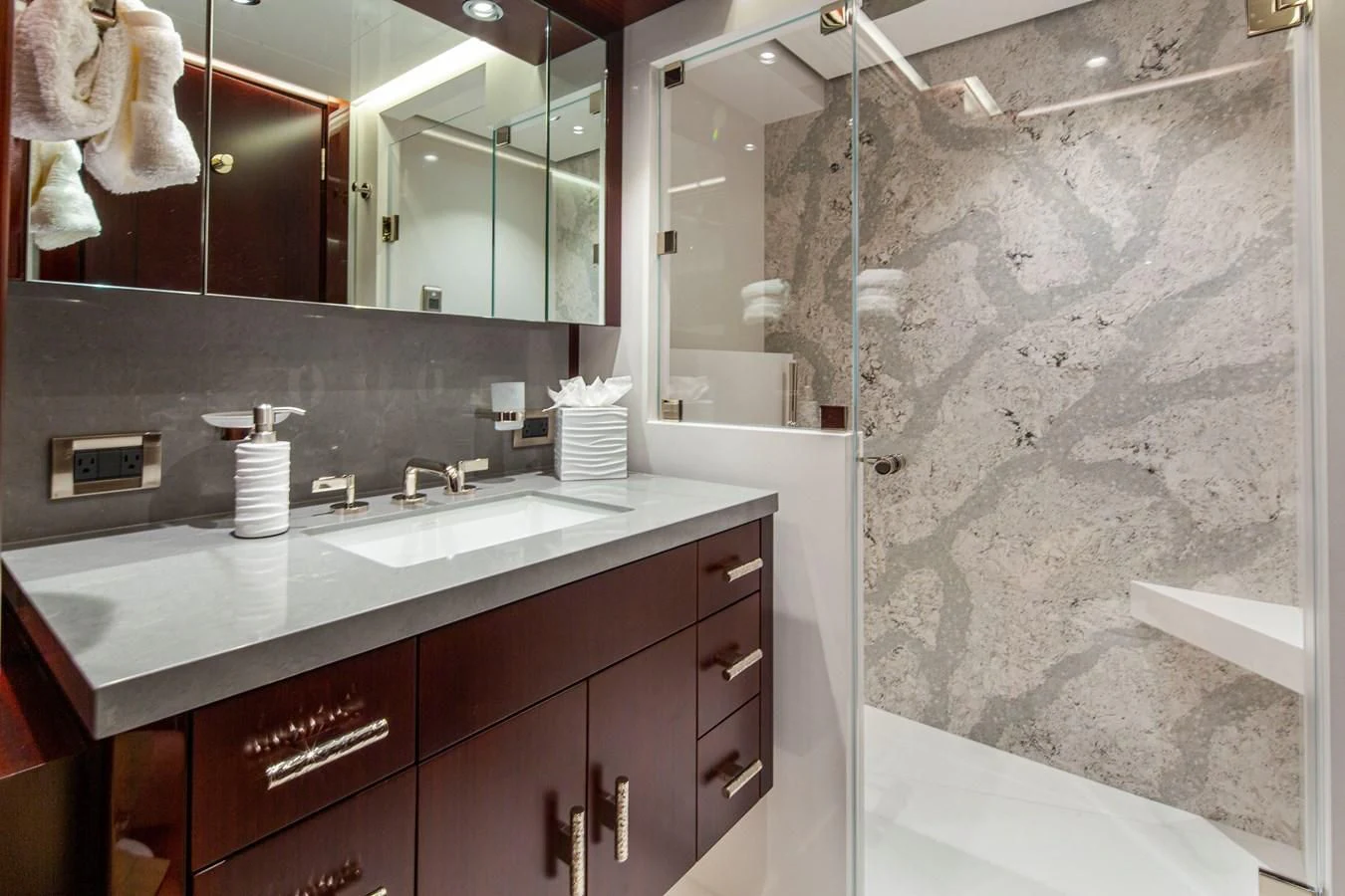 a bathroom with a marble counter top aboard LION'S DEN Yacht for Sale