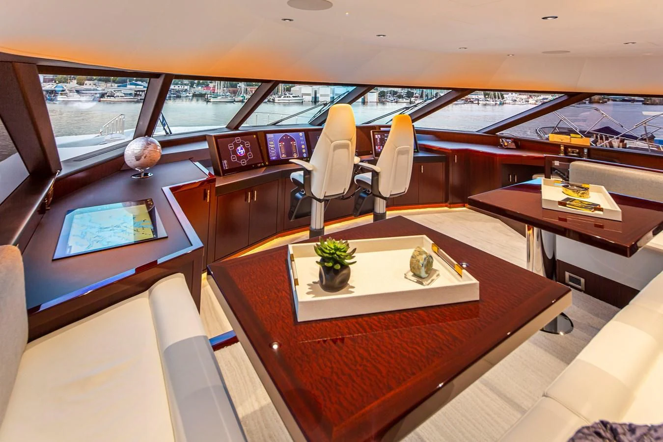 inside of a vehicle with a table and chairs and plants aboard LION'S DEN Yacht for Sale