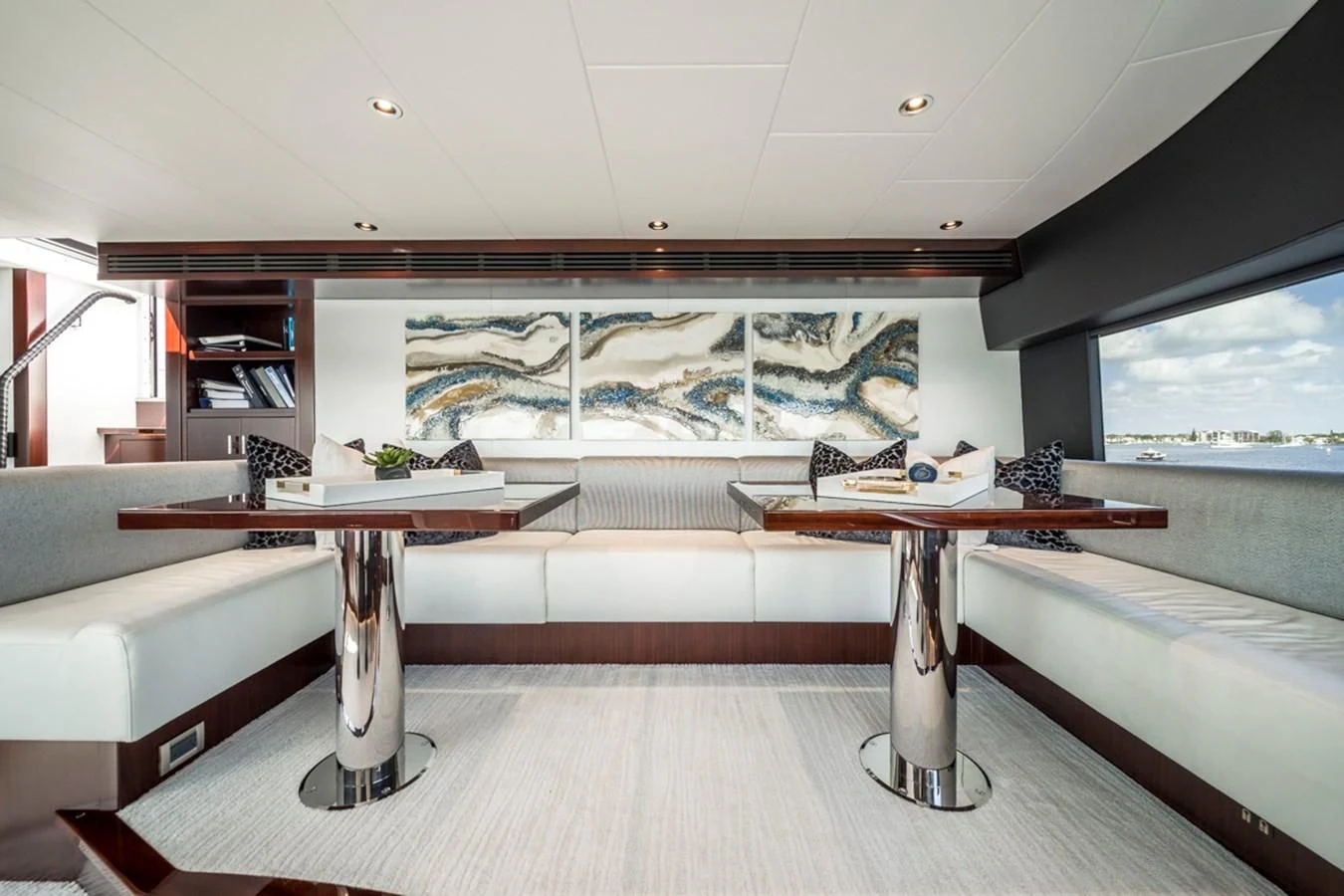a room with a table and a couch aboard LION'S DEN Yacht for Sale