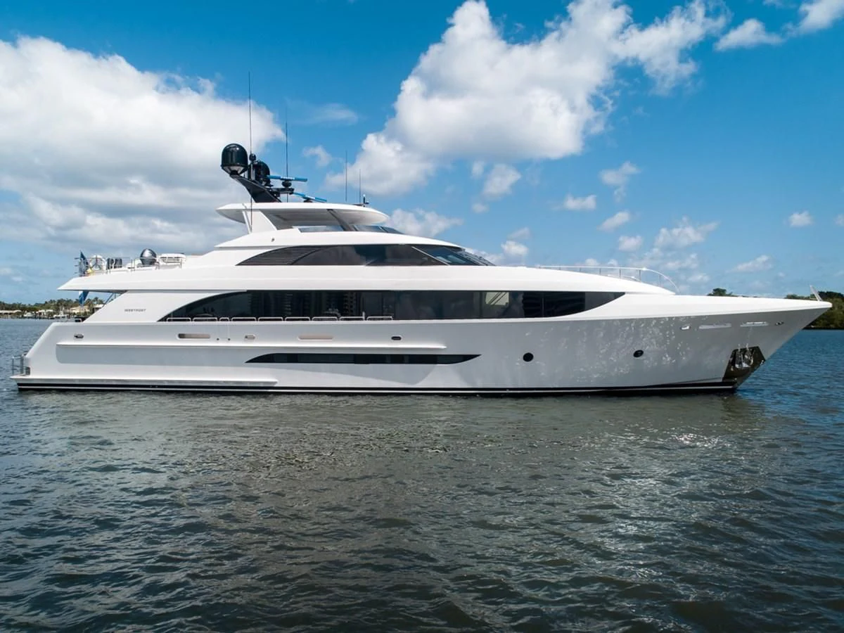 a white yacht on the water aboard LION'S DEN Yacht for Sale