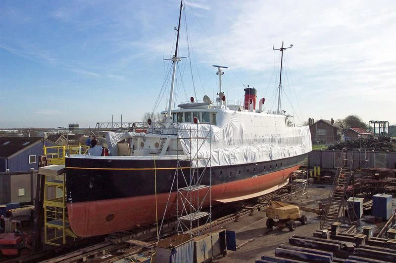 a large white boat in a dock aboard ELSA Yacht for Sale