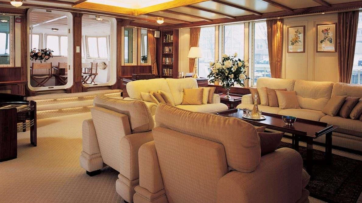 a living room with a large window aboard ELSA Yacht for Sale