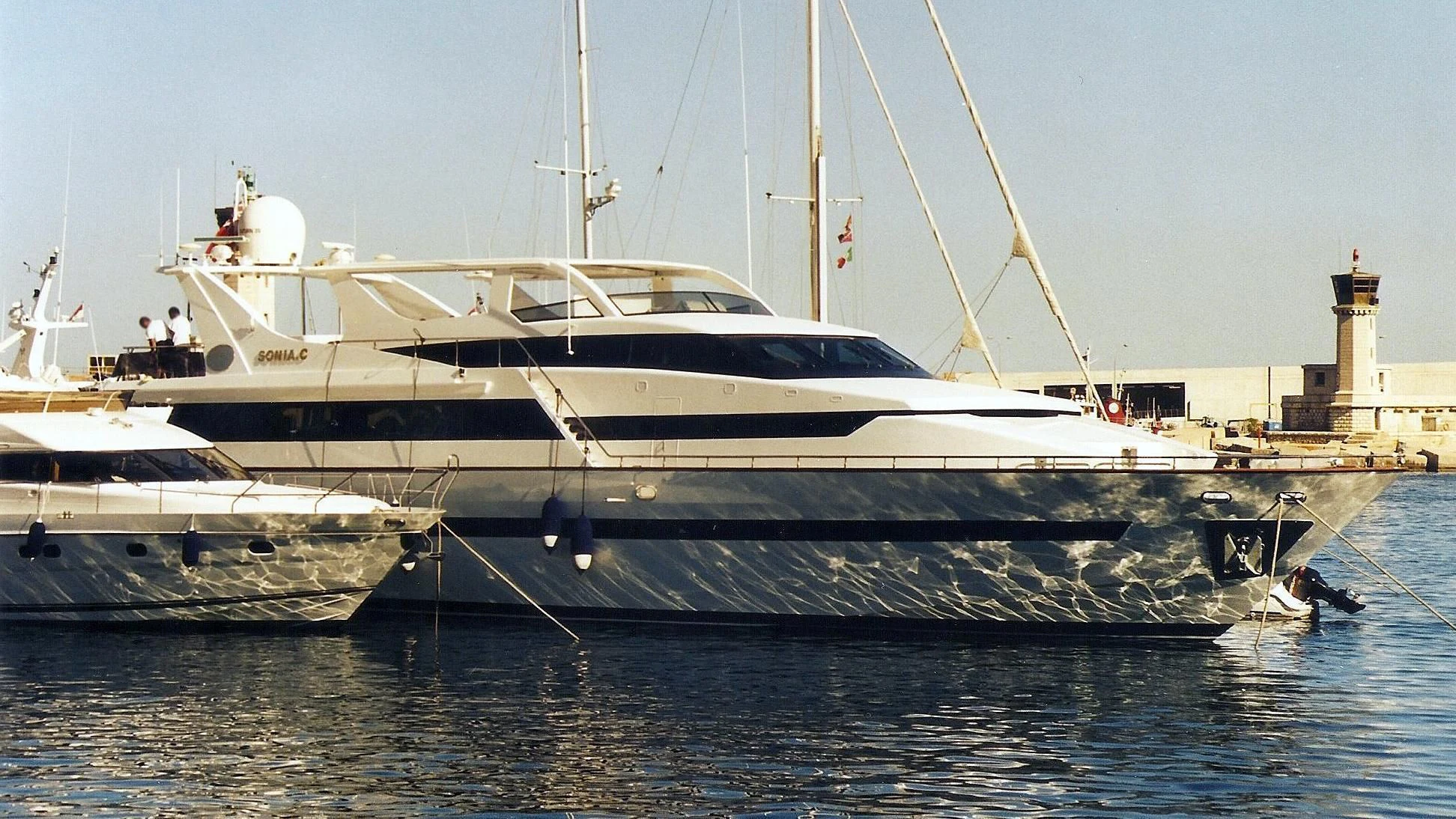 a couple of boats are parked in the water aboard SONIA C Yacht for Sale